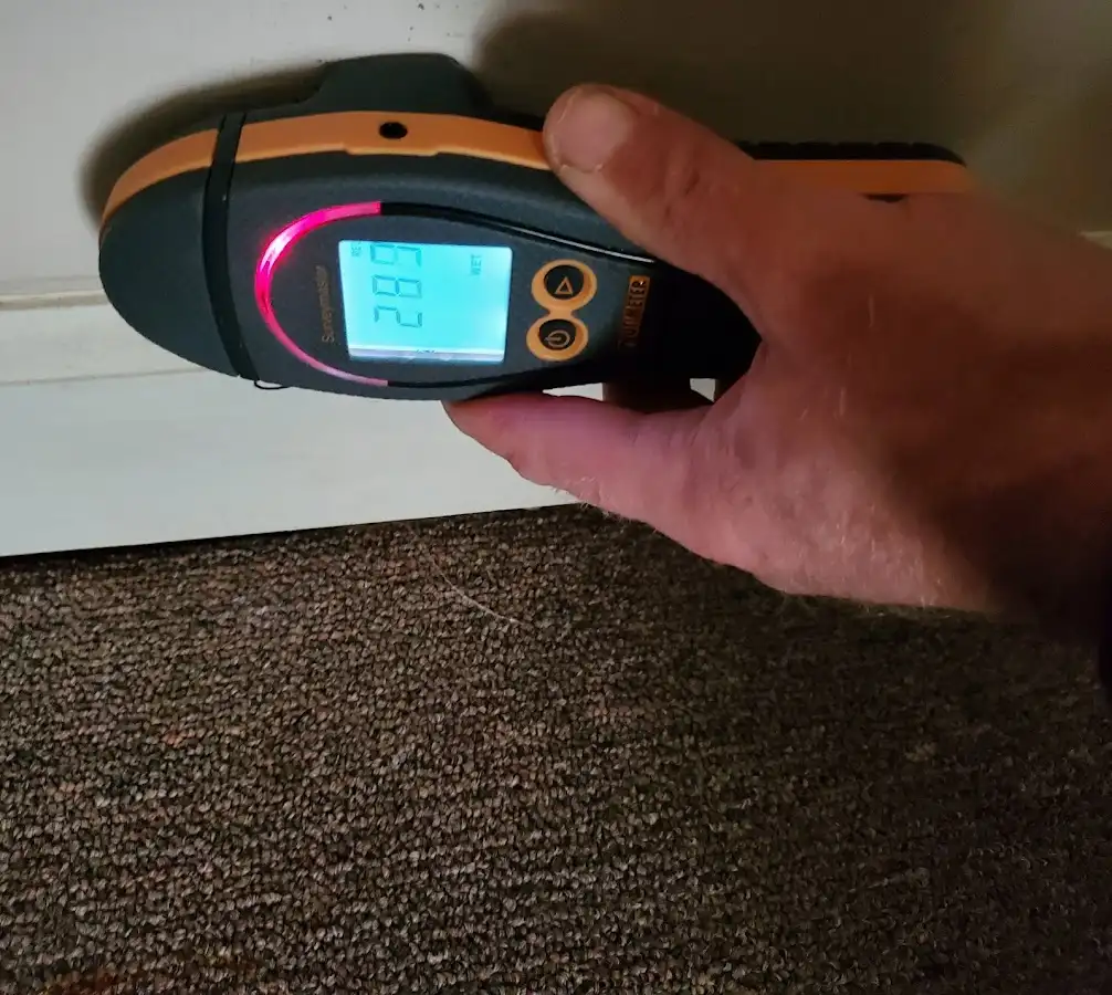 Moisture detection at baseboard during Storm Damage Restoration in District Heights